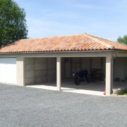 Garage préfabriqué béton 3 pentes et 1 porte avec auvent